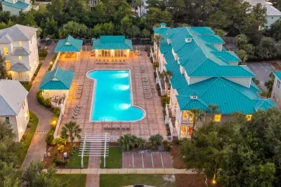 Dusk over the community pool, just a short walk from the unit. Cool off after the beach, then stay for the glow when the lights come on.