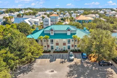The building from above with parking right beside it and the village just beyond. Public parking is directly outside the unit.