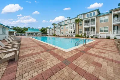 The community pool with paver decks and plenty of loungers, an easy walk from the unit. Swim before breakfast or after the beach.