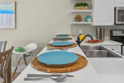 The kitchen counter set for a casual breakfast right beside the sink, with everything you need close at hand for the morning rush.