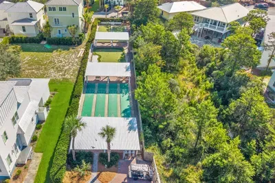 From above, the community's shuffleboard courts and green space sit just beyond the buildings. There is always something to do close to home.