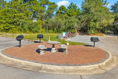 Park-style charcoal grills on a brick circle with seating nearby. Bring your own charcoal and cook dinner outside with the neighbors.