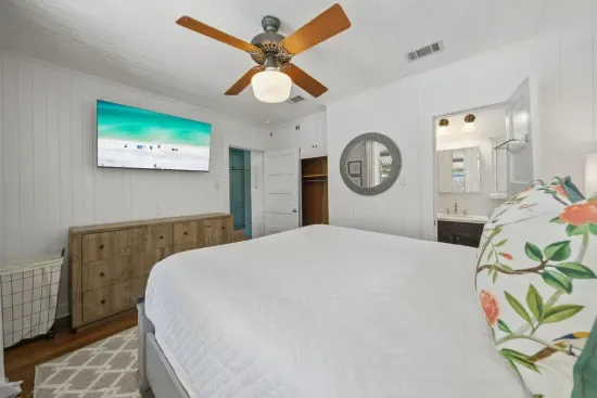 The queen guest room is full of natural light and easy comfort, with a smart TV and a private ensuite of its own.