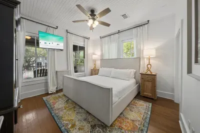 The spacious master suite offers a king bed, ceiling fan, and a private ensuite — your quiet retreat after a day in the sun.