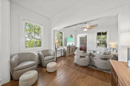 Comfortable, connected, and full of natural light, the living area opens to the dining space so the whole group stays together.