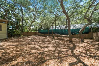 Find your slow afternoon in the backyard, where a hammock sways in the shade of Grayton's live oaks.