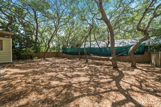 Find your slow afternoon in the backyard, where a hammock sways in the shade of Grayton's live oaks.