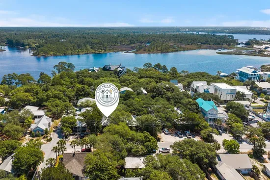 Historic Grayton Beach from above — emerald water and white sand just a couple of blocks from your door.