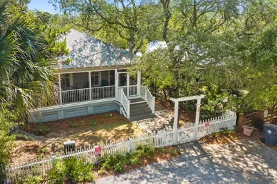 The home's classic Grayton exterior, with a parallel parking pad out front that fits two vehicles.