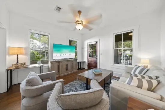 Swivel chairs and a cozy sofa make the great room perfect for movie nights or catching up after a day on the sand.