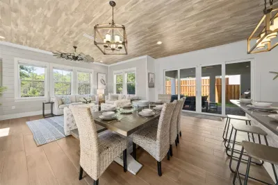 The dining area flows naturally between the kitchen and the outdoor space.