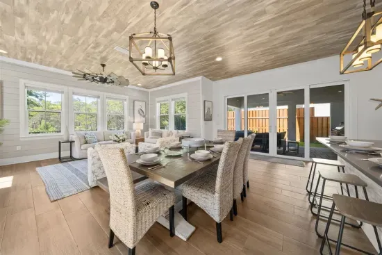 The dining area flows naturally between the kitchen and the outdoor space.