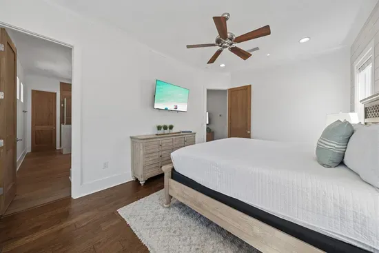 The master suite has everything — 55" TV, walk-in closet, and a private en-suite bath, tucked away at the end of the hall for a true retreat feel.