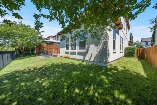 Fully fenced and surprisingly spacious — the yard gives kids and dogs room to run while you relax poolside without a care.