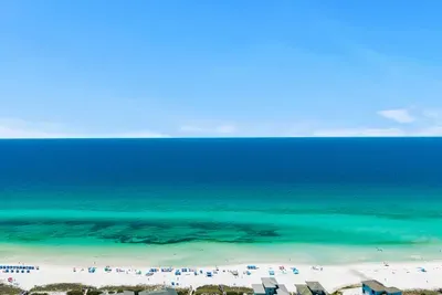 This is what you'll be walking to — just a half mile from the front door. Emerald green water, white sand, and the Gulf.