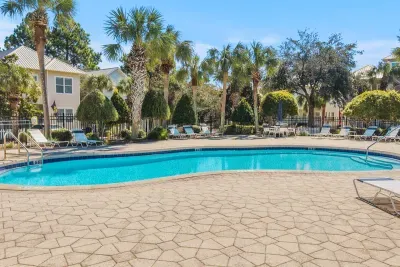 The community pool is right out the front door, so a refreshing dip is only a few steps away after a day at the beach.