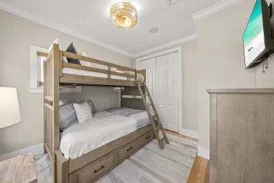 This bunk room has plenty of sleeping space, a TV, a dresser and a closet, which kids love.
