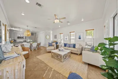 An open floor plan connects the living room, dining area and kitchen, so everyone can cook, chat and watch the game together.