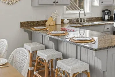 Three stools at the kitchen island make a casual spot for breakfast, snacks and homework.