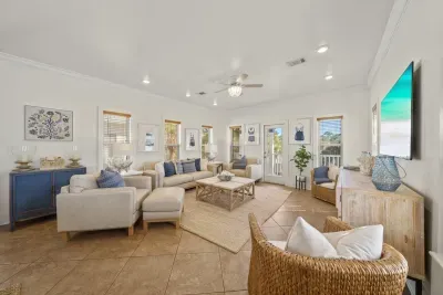Seating for seven to eight, a 52 inch Smart TV and relaxed coastal decor make the main living room the heart of the home.
