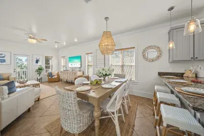 The dining table seats six, with the living room just beyond, perfect for family dinners and card games that run late.