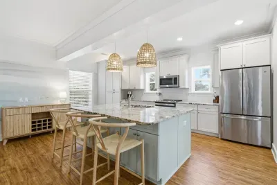 Kitchen and dining area with stainless appliances and ample seating
