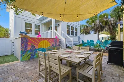 Outdoor dining area with seating for group meals by the pool