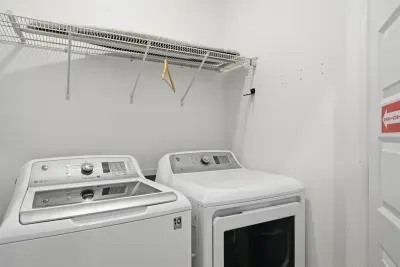 Laundry area with washer and dryer for longer stays and beach days