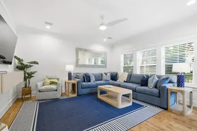 Spacious living room with comfortable seating and natural light throughout