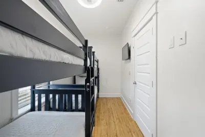Bunk room layout with bunks and hallway access