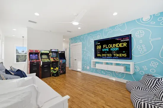 Kids’ bonus room with arcade games and 85 inch TV for downtime and play