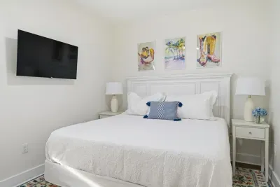 Guest bedroom with king bed and comfortable, inviting layout