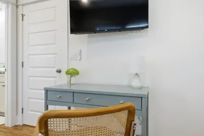 Bedroom workspace with desk and TV—ideal for light remote work