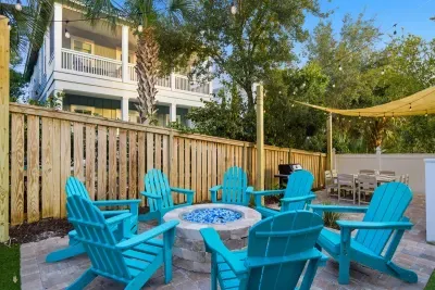 Poolside seating area with fire pit for evenings outdoors