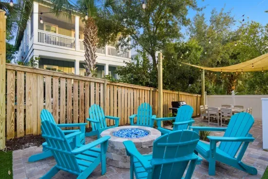 Poolside seating area with fire pit for evenings outdoors