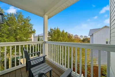 Private balcony off master bedroom with seating to enjoy fresh air and quiet moments