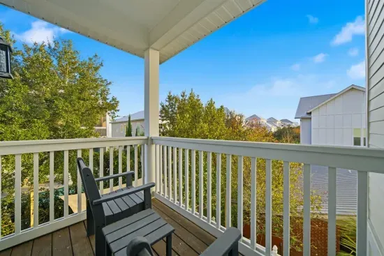 Private balcony off master bedroom with seating to enjoy fresh air and quiet moments