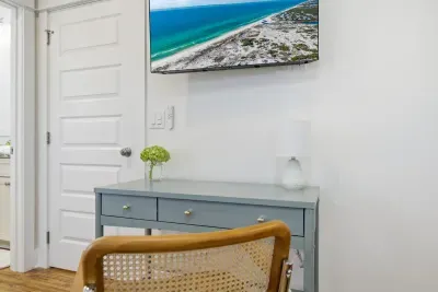 Bedroom workspace with desk and TV—ideal for light remote work