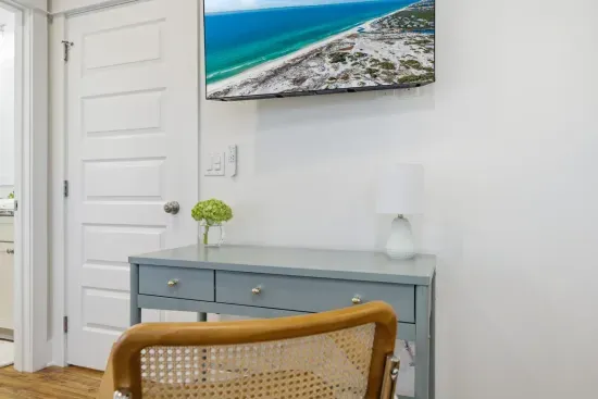 Bedroom workspace with desk and TV—ideal for light remote work
