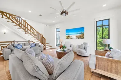 High ceilings, tall windows, and a big screen over the console. This is where the beach day winds down.