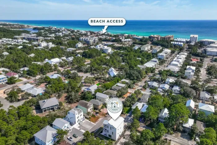 The neighborhood from above, with the home marked and the nearest beach access called out. It is about 0.4 miles to the sand, a short walk or a quick ride.