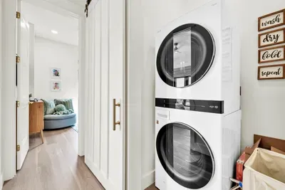 A second laundry set, stacked in its own closet upstairs. Two sets in a house this size is the difference between keeping up and falling behind.