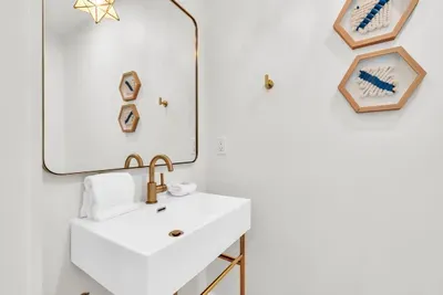 A powder room on the main level, so guests never have to wander into a bedroom to find a sink.