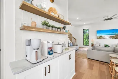 Drip coffee, a pod brewer, and a toaster on a lit counter of their own. First one up can get the morning going without waking the house.