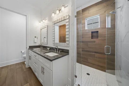 Double sink vanity with plenty of counter space — no sharing, no waiting. 1st floor bedroom