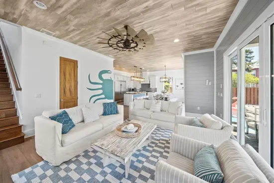 Bright, coastal, and comfortable — the main living space where everyone naturally comes together.