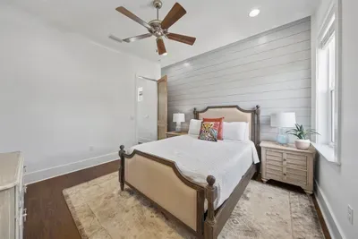 The second queen bedroom — light-filled, well-appointed, and connected to the shared Jack and Jill bath.
