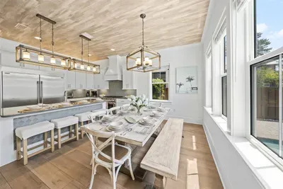 Open-concept flow from kitchen to dining — the kind of layout that makes group trips feel effortless.