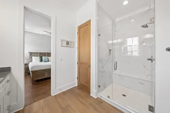 A beautifully appointed Jack and Jill bathroom shared between the two queen bedrooms — stylish and functional.