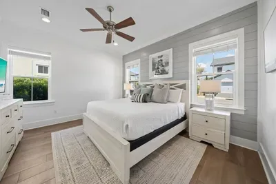 King Bed on First Floor. Bright and airy with coastal touches — a restful retreat after a full day at the beach.